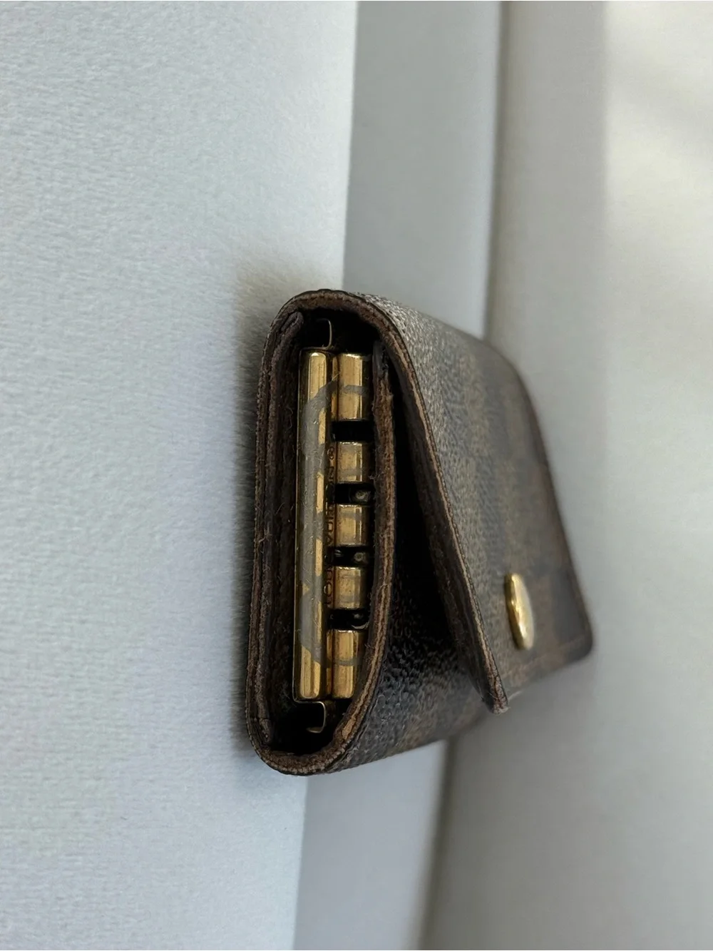 SOLD Louis Vuitton Brown Damier Ebene Canvas Key Pouch with Gold Button